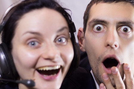 Dispatchers man and woman in a call center fooling around