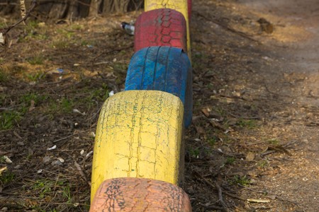 Colored tires in the yard as a decorationの写真素材