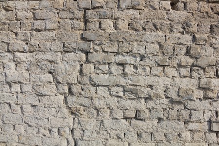 The original white brick wall with crack as a backgroundの写真素材