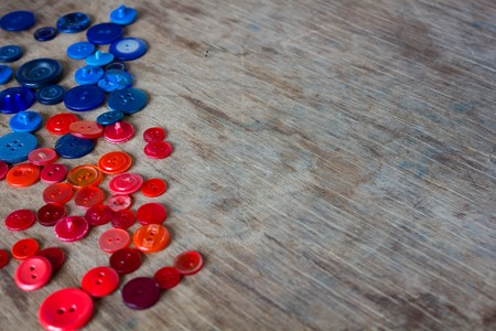 trendy red green and blue buttons on a stylish wooden background