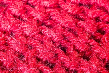 Red Knitted Wool as Background and textureの写真素材