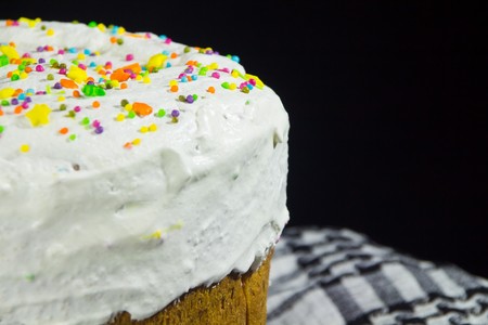 Small multi-colored Easter powder on the cake close up viewの写真素材