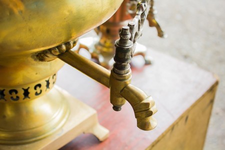 Big iron yellow samovar at the flea marketの写真素材