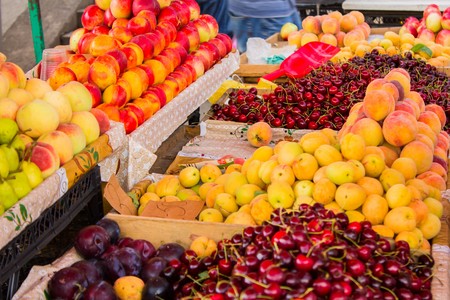 many different fruits on a market stall in Georgiaの写真素材