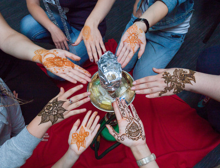 Seven women show mehndi tattooの写真素材