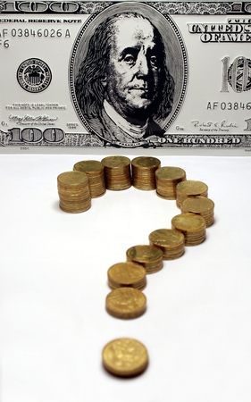 Question mark made from coins in front of Franklin portraitの写真素材