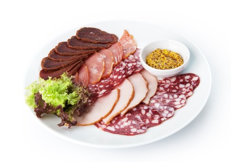 Restaurant food - meat assortment plate with french mustard isolated at the white backgroundの写真素材