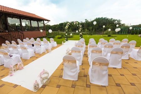 Wedding ceremony set in beautiful gardenの写真素材