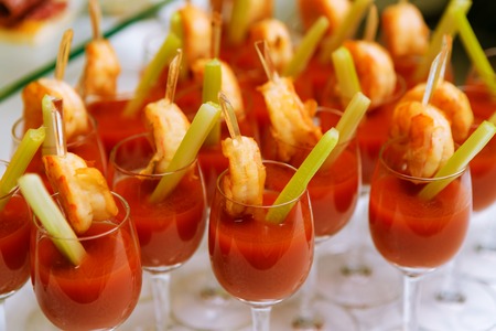 Catering - snack coctails with tomato juice and shrimps. Closeupの写真素材