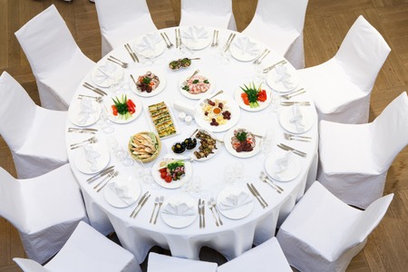Beautifully organized event - served banquet tables ready for guestsの写真素材