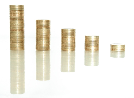 Columns of golden coins against a white 