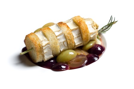 Mediterranean restaurant cuisine - Brie appetizer on a white plateの写真素材