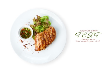 Restaurant food - chicken fillet grilled steak isolated at the white backgroundの写真素材