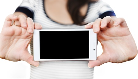 Woman's hands holding white smartphone with black screenの写真素材