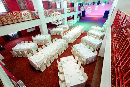 Beautifully organized event - served festive white tables ready for guests.の写真素材