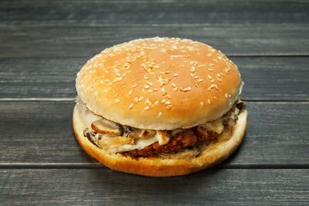 Cheeseburger on rustic wooden background.の写真素材