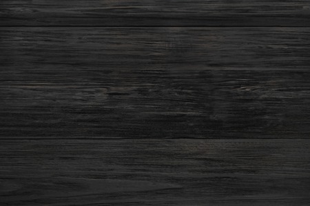 Black rustic wood texture and background. Black wood texture background. Rustic, old wooden background. Aged wood planks texture pattern. Wooden surface. Vertical image.の写真素材