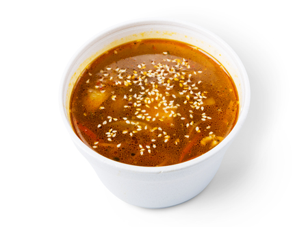 Asian japanese cuisine - red fish soup with sesame isolated at white background, diet and vegetarian foodの写真素材