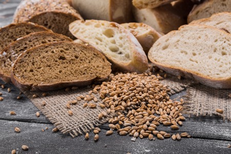 Plenty of sliced bread background. Bakery and grocery concept. Fresh, healthy whole grain sliced...