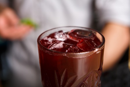 Closeup of healthy sweet berry non-alcoholic party cocktail at restaurant background. Refreshing...