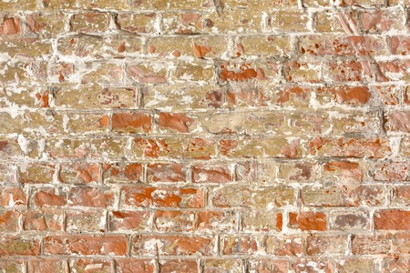 Old grunge brick wall background. Weathered urban texture, architectural detail pattern