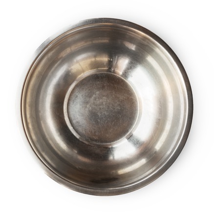 Metal salad bowl top view on white background. Aluminium cooking utencil, dishware for professional kitchenの写真素材