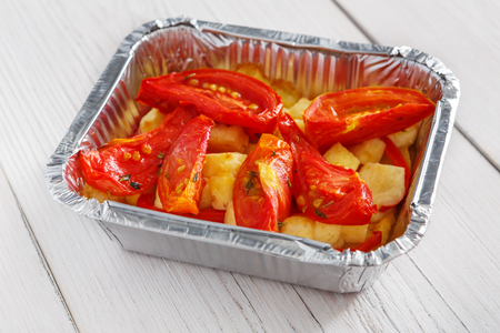 Healthy lunch container. Diet nutrition in foil boxes. Steamed vegetablesの写真素材