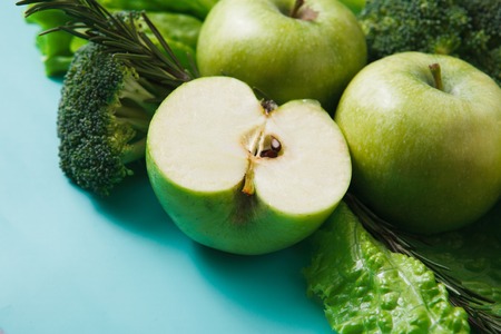Green vegetables and fruits closeup. Diet, detox and healthy food concept. Ingredients for salad, greenery onlyの写真素材
