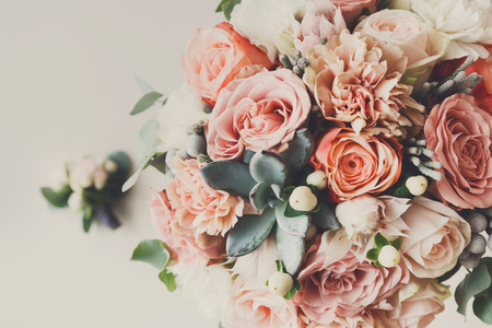 Wedding flowers, bridal bouquet closeup. Decoration made of roses, peonies and decorative plants, close-up, selective focus, nobody, objectsの写真素材