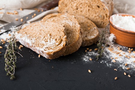 Bakery background, bread on black. Flour and grain with copy spaceの写真素材