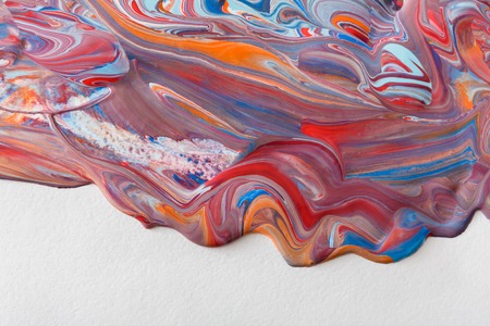 Liquid marbling paint flow on white background. Fluid painting abstract texture. Colorful mix of acrylic vibrant colors.の写真素材