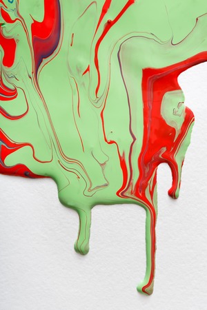 Liquid marbling paint flow on white background. Fluid painting abstract texture. Colorful mix of acrylic vibrant colors.の写真素材