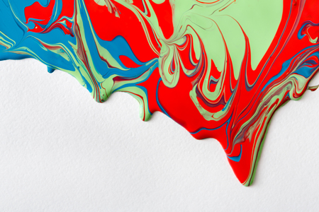 Liquid marbling paint flow on white background. Fluid painting abstract texture. Colorful mix of acrylic vibrant colors.の写真素材