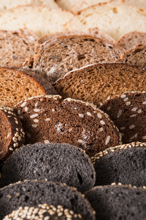 Sliced black bread gradient background. Bakery and grocery concept. Fresh, healthy whole grain...