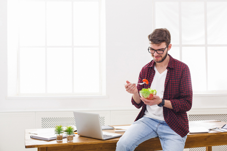 man lunch with fresh salad, copy spaceの写真素材