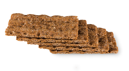 Fresh rye yeast free crispy bread with sunflower seeds isolated on white background, cutout. Whole grain healthy mealの写真素材