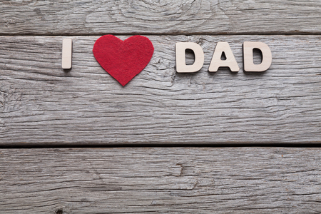 Happy Fathers Day card with copy space, I love dad wooden letters on rustic wood backgroundの写真素材