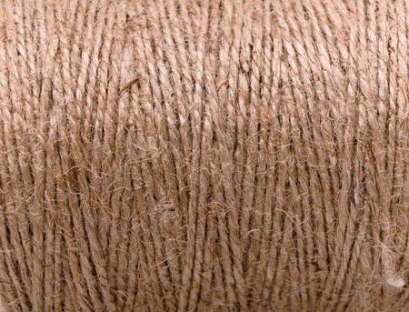 Natural jute twine texture. Close up of twisted rope, handmade or gardening background