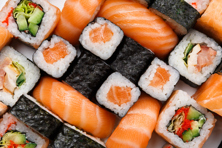 Sushi and rolls pattern background, japanese restaurant delivery top view. Salmon, unagi, california and other healthy mealsの写真素材