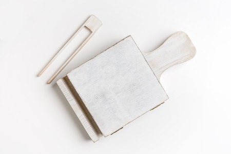 Wooden box for sugar and tongs on table, top view, white isolated background, copy spaceの写真素材