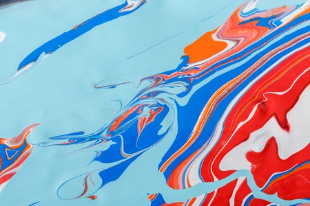 Liquid marbling paint background. Fluid painting abstract texture, blue and red. Intensive color mixの写真素材