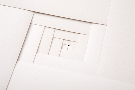 Paper geometric composition, abstract background. Creative composition of white sheets, labyrinth pattern, copy spaceの写真素材