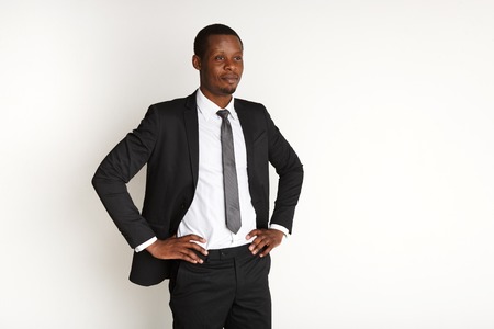 Handsome african american business man posing isolated. Young confident businessman in suit. Success, professional conceptの写真素材