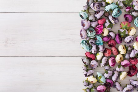 Hair rubbers decorated with flowers, flat lay background. Beautiful handmade scrunchies assortment, female decoration, beauty concept, copy space for textの写真素材