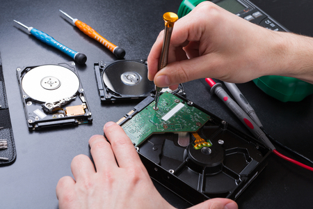 Hard disc drive disassembling close up.の写真素材