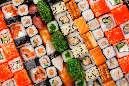 Sushi and rolls pattern background, japanese restaurant delivery top view. Salmon, unagi, california and other healthy mealsの写真素材
