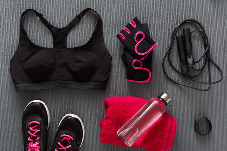 Female sport clothing and equipment flat lay, top view. Set of new fitness wear for women, active lifestyle, body care conceptの写真素材