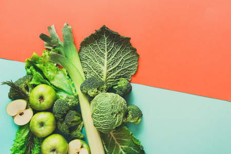 Green vegetables and fruits. Diet, detox and healthy food concept - top view flat lay of vegetarian meals on bright background. Ingredients for saladの写真素材