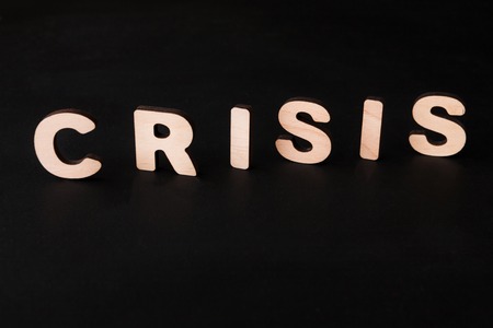 Word Crisis on black background. Unfortune, failure, bad luck conceptの写真素材