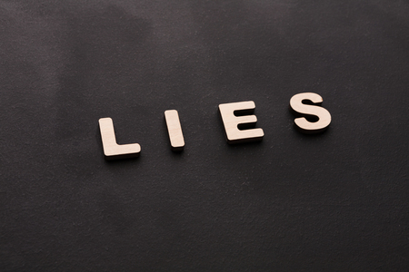 Word Lies on black background. Untruth, taradiddle, fake conceptの写真素材